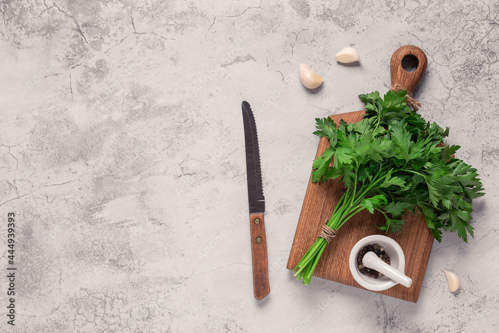 cutting board, parsley on a concrete table cutting board, parsley on a concrete table