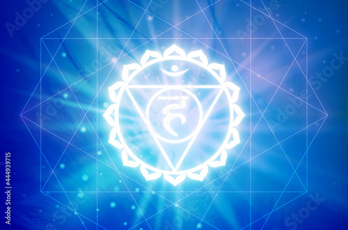 Vishudha Chakra symbol on a blue background. This is the fifth Chakra, also called The Throat Chakra photo