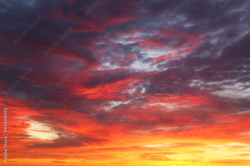 Sunset on colorful dramatic sky with red and orange clouds. Picturesque landscape for background with soft colors