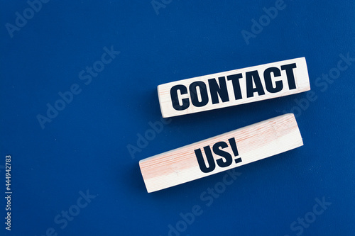 Contact Us word written on wood block.