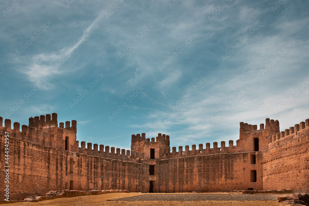 Photograph of the interior of the castle of Baños de la Encina, a small town in Jaén, Spain, accompanied by a powerful and beautiful blue sky.