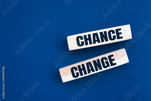 Chance or change word from wooden blocks on desk