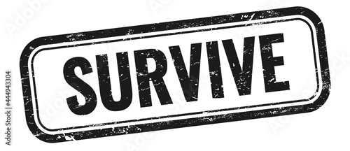 SURVIVE text on black grungy vintage stamp.