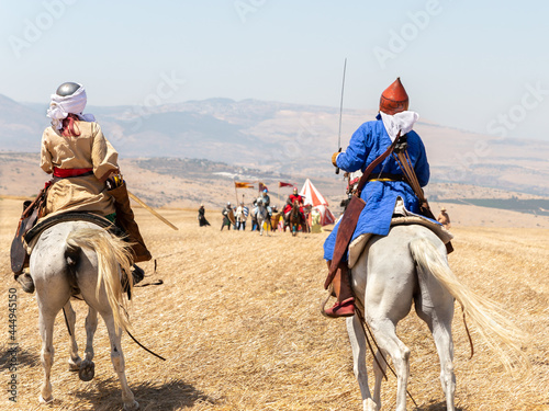 Horse and foot warriors - participants in the reconstruction of Horns of Hattin battle in 1187, are on the battle site, near TIberias, Israel © svarshik