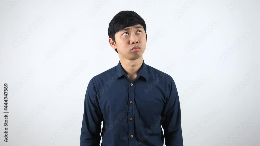 Asian man feeling panic and afraid on white background,Man in fear and confused emotion concept Asian man feeling panic and afraid on white background,Man in fear and confused emotion concept