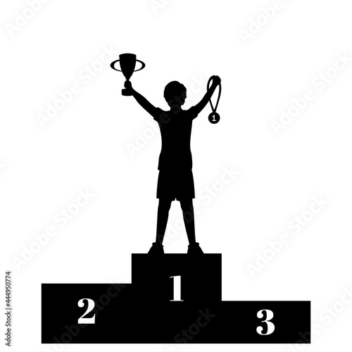Silhouette boy winner of competition with cup and medal on the pedestal. Victory celebration.