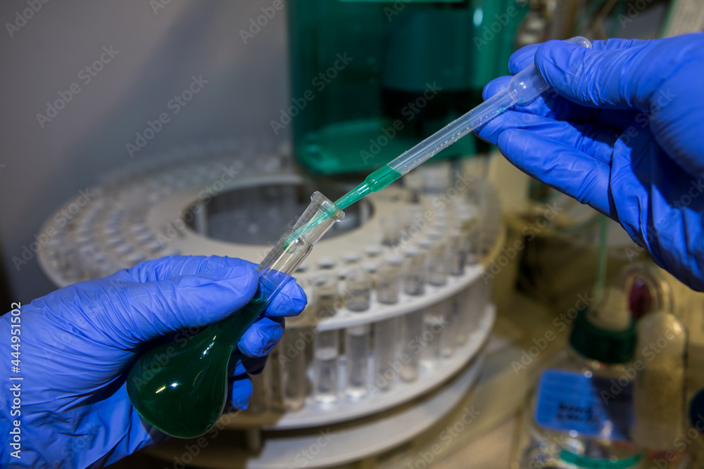 Scientist analysing CBD oil in a chemistry laboratory. Ion ...