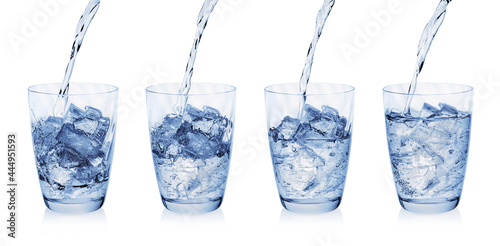 Water pouring into glass with ice cubes isolated on white background. Set of glasses with water and ice.