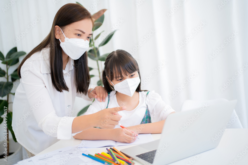 Mother and daughter studying online with Zoom program at home together, New Normal. Mother and daughter studying online with Zoom program at home together, New Normal.