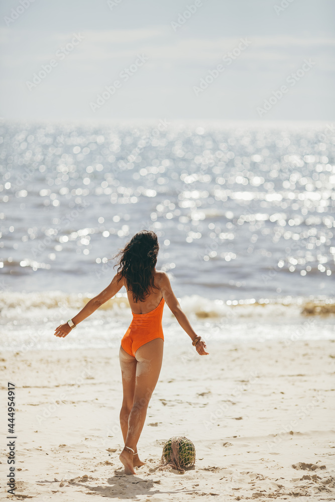 Fototapeta premium Woman in Swimsuit with Watermelon on the Beach Outdoors