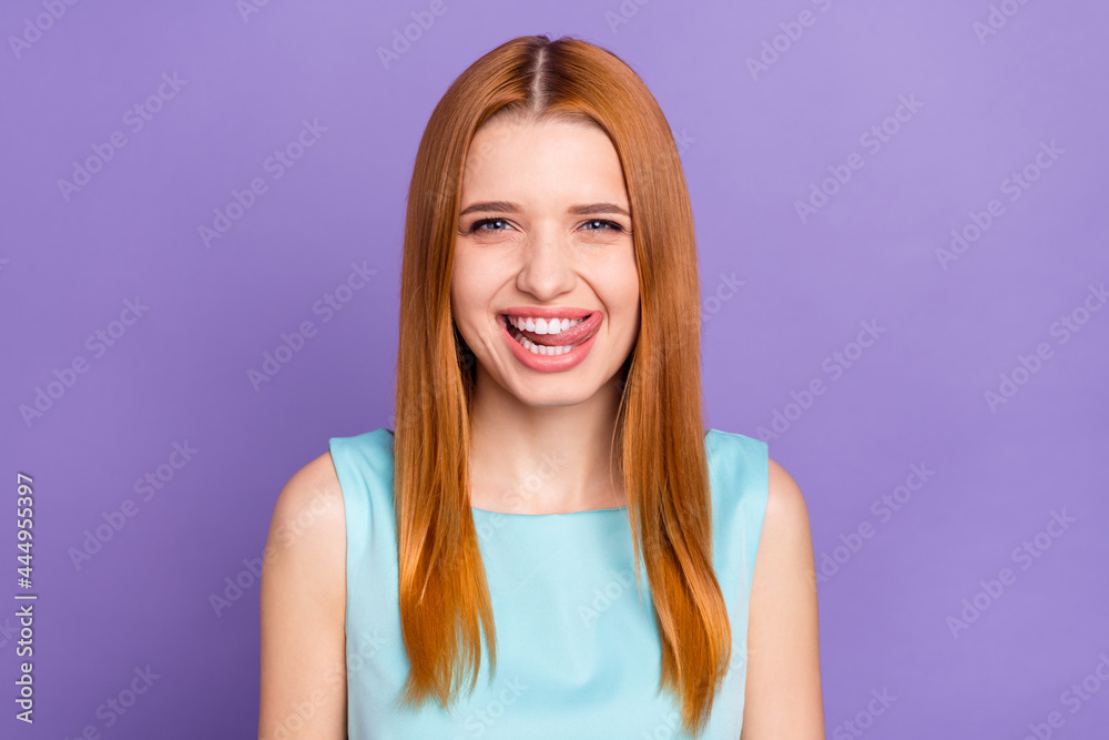 Photo of charming happy positive young woman lick teeth tasty good mood isolated on purple color background