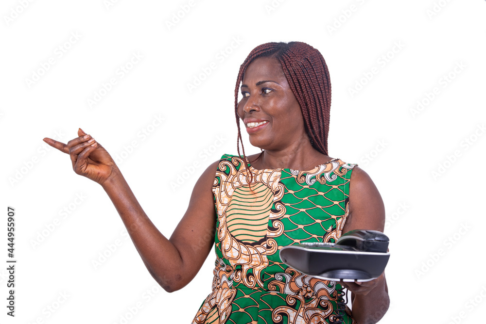 adult woman holding mobile phone and pointing finger aside smiling. adult woman holding mobile phone and pointing finger aside smiling.