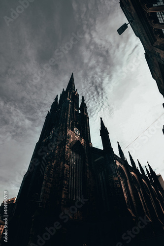 The  historic buildings in the city of edinburgh, shot taken at twilight, looking like a ghost town, view of the cathedral on the kings mile