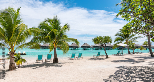 Luxury travel resort at white tropical beach of French Polynesia, Society Islands. © Nancy Pauwels