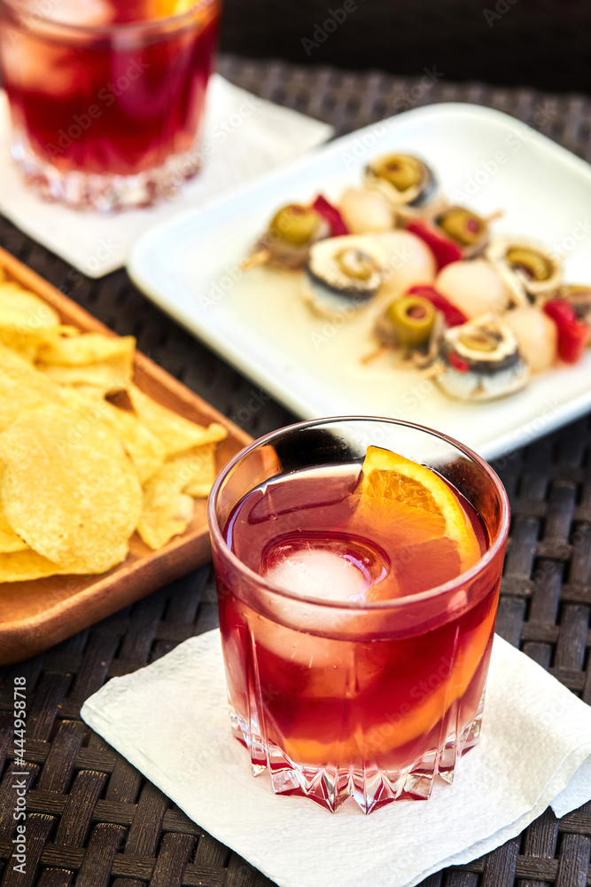 Old fashioned cocktail on table with appetizers Old fashioned cocktail on table with appetizers