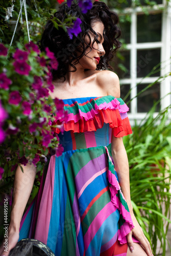 Beautiful sensual woman portrait outdoor in flowers dress