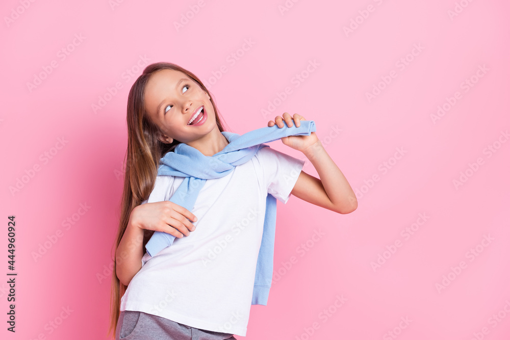 Portrait of attractive cheerful dreamy preteen girl having fun creating idea isolated over pink pastel color background Portrait of attractive cheerful dreamy preteen girl having fun creating idea isolated over pink pastel color background