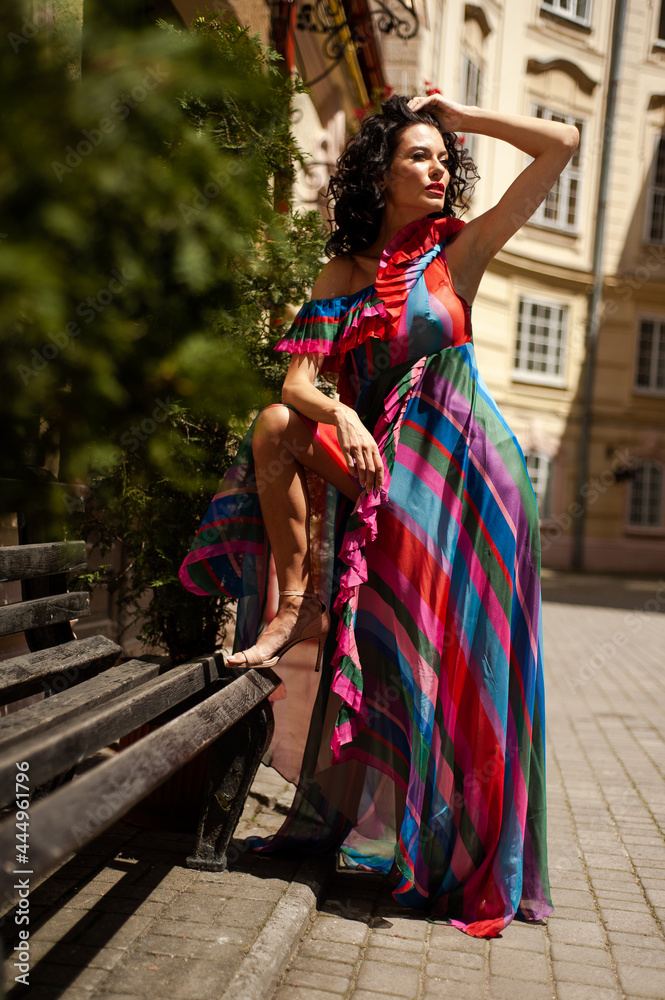 Naklejka premium Beautiful sensual woman portrait outdoor in flowers dress