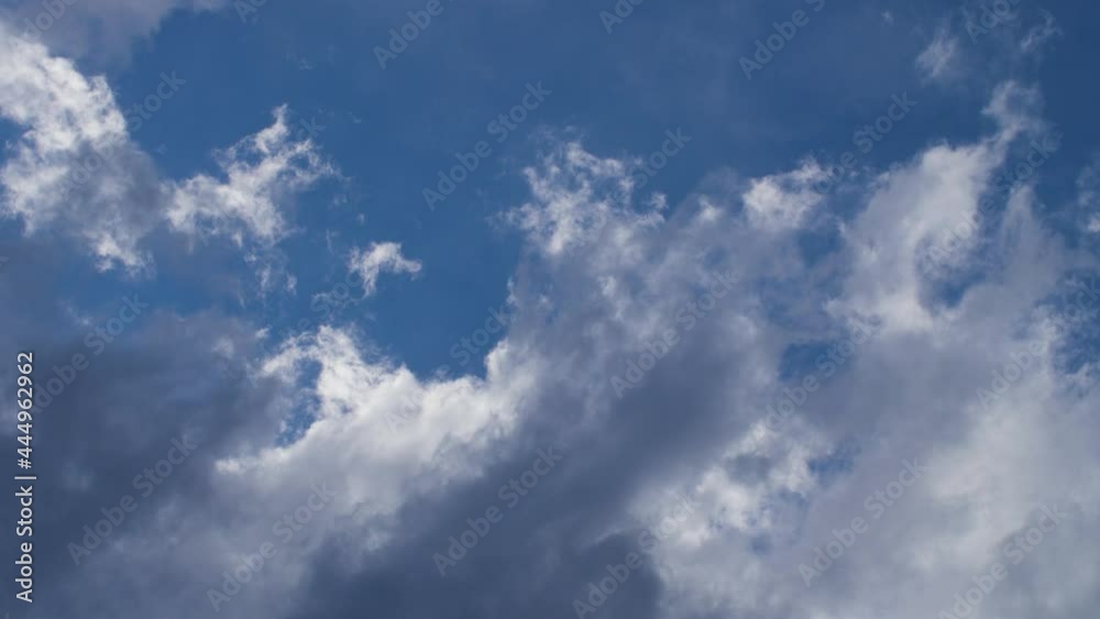 Moving close up of white and gray storm clouds with blue sky in background. Cloudy and windy weather during the day. Dark storm rain clouds. Concept of weather forecast, clean air. 4K. Moving close up of white and gray storm clouds with blue sky in background. Cloudy and windy weather during the day. Dark storm rain clouds. Concept of weather forecast, clean air. 4K.