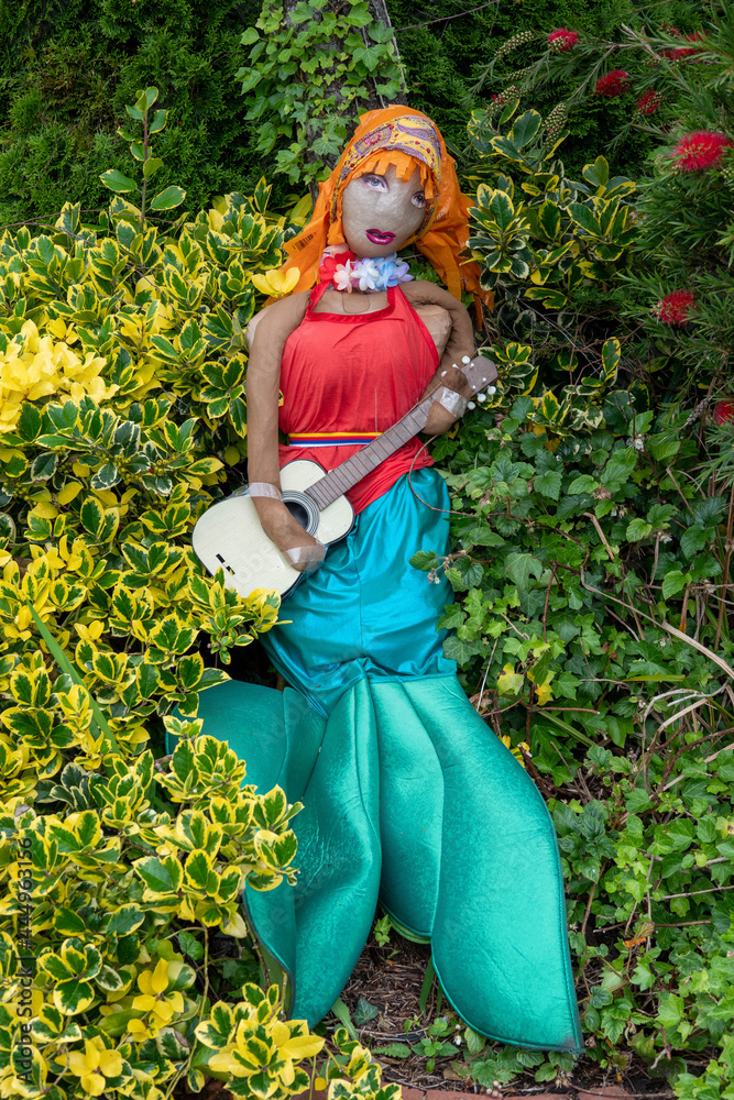 bright colourful mermaid scarecrow with a guitar bright colourful mermaid scarecrow with a guitar
