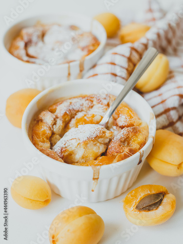 Homemade apricot clafoutis, traditional summer French sweet fruit pie.