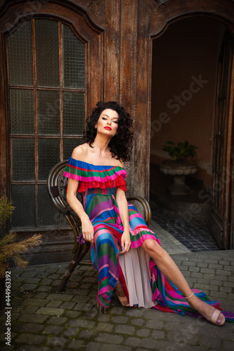 Woman wearing flowers dress in hot summer city