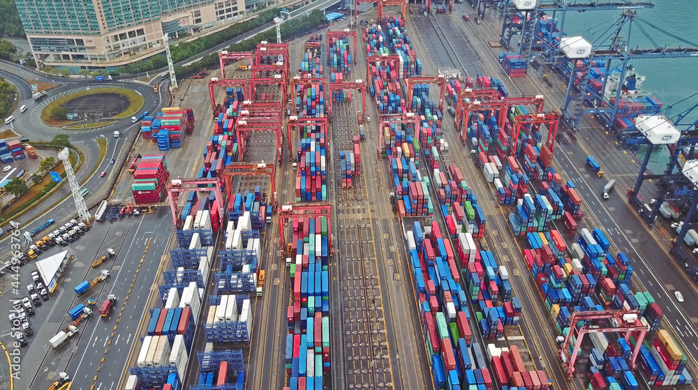 HONG KONG. February 20. Aerial view of huge industrial port with containers and huge ship. HONG KONG. February 20. Aerial view of huge industrial port with containers and huge ship.