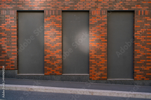building wall with place for text. blank banner on the wall of the building. facade of a brick house with copy-space
