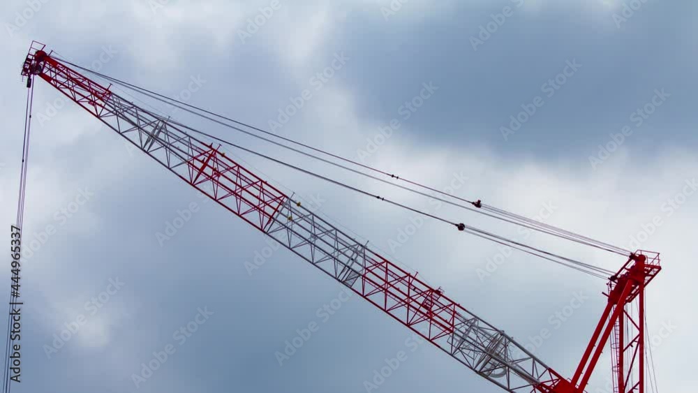 A timelapse of crane at the under construction in Shinjuku long shot panning A timelapse of crane at the under construction in Shinjuku long shot panning