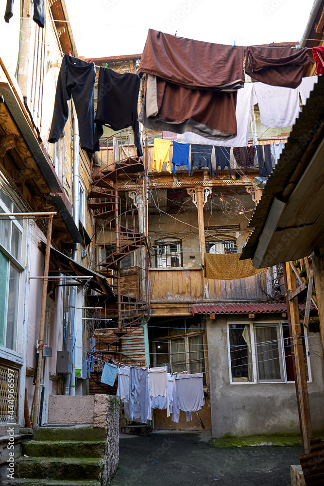 Household traditions in Georgia. The washed laundry is dried on the balcony outside Household traditions in Georgia. The washed laundry is dried on the balcony outside