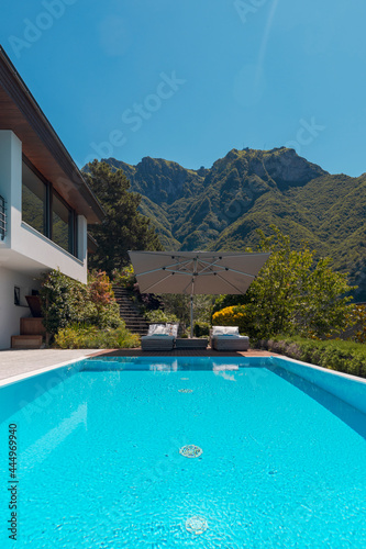 Modern two-story house with large pool overlooking the mountains. Nobody inside © alexandre zveiger