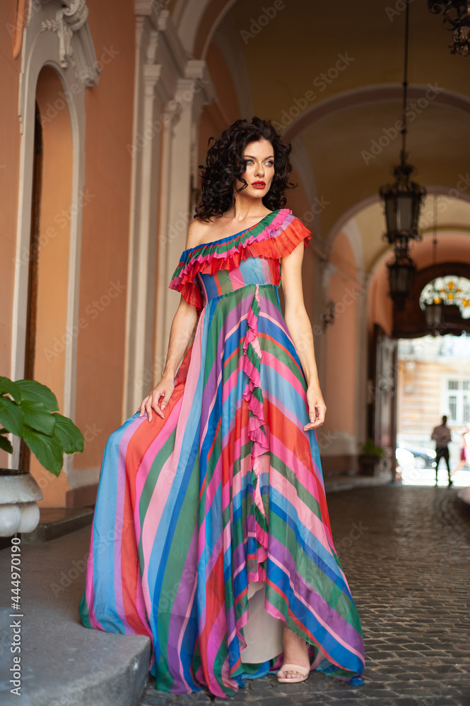 Fototapeta premium High fashion model in elegant clothing woman outdoor. Floral dress. Sexy tanned woman.