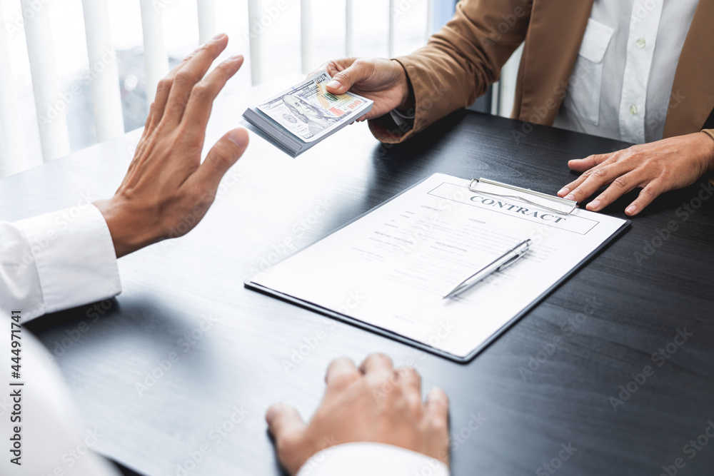 Businessman partner hand gesture rejecting refusing money, anticorruption concept. Businessman partner hand gesture rejecting refusing money, anticorruption concept.