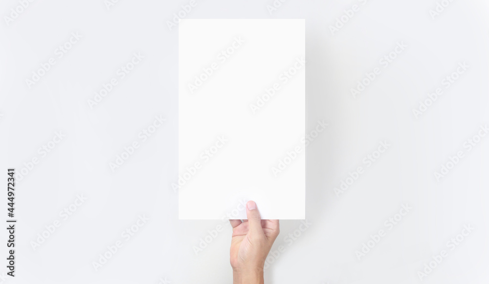 Hands holding paper blank for letter paper Hands holding paper blank for letter paper