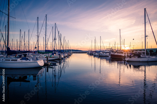 Sailboats Docked in Marina During Sunset