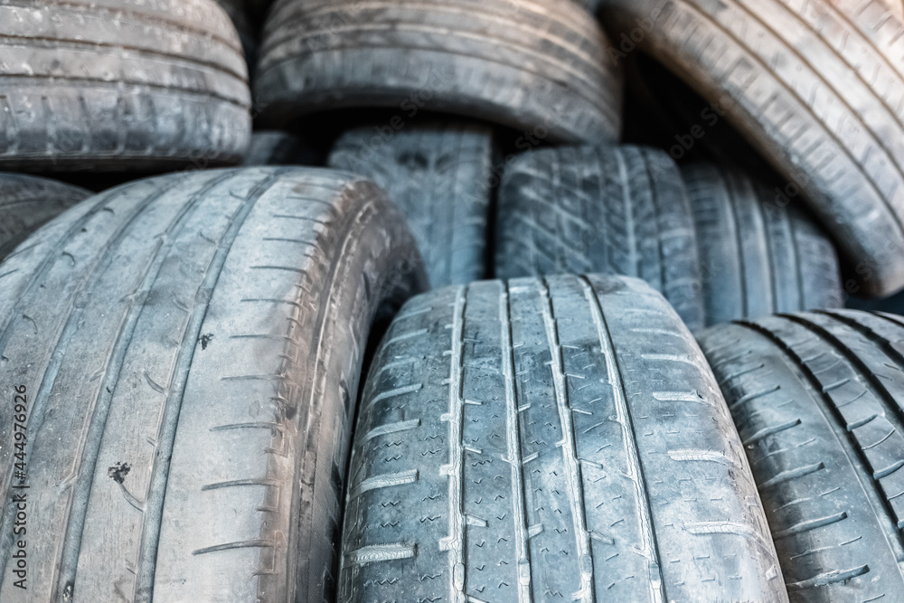 Detail of old used and retired tires, piled up in a treatment plant. Detail of old used and retired tires, piled up in a treatment plant.