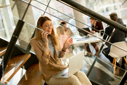 Young woman sitting on the ...