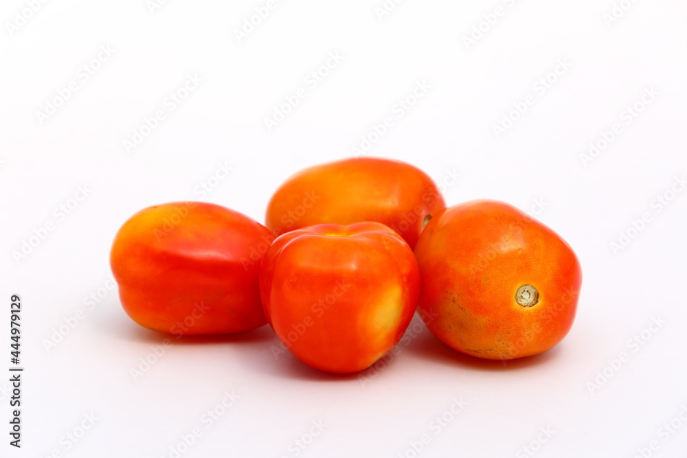 Group of fresh red tomatoes isolated on white background Group of fresh red tomatoes isolated on white background