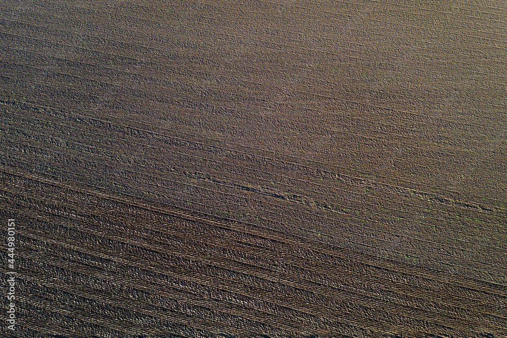 Naklejka premium Un champ de terre grasse qui vient d'être labourer en hiver