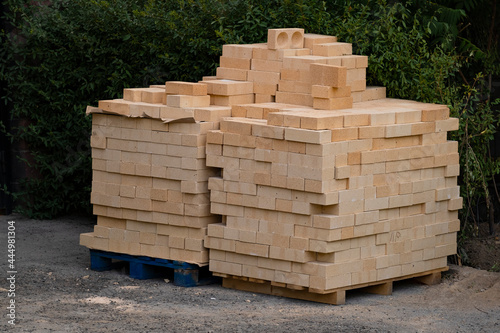 The building material is stacked on a wooden pallet.