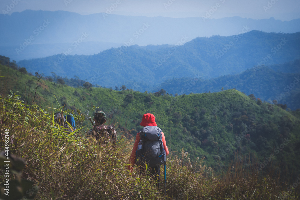 hiking group on mountain at Khao Chang Phuak, Thongphaphoom National Park, Kanchanaburi Province, Thailand. Subject is blurred, noise and color effect.