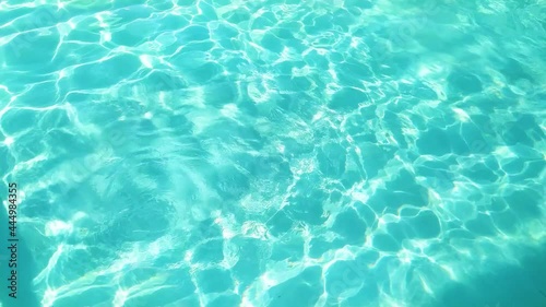 Ocean rippling turquoise water on the beach, at summer.