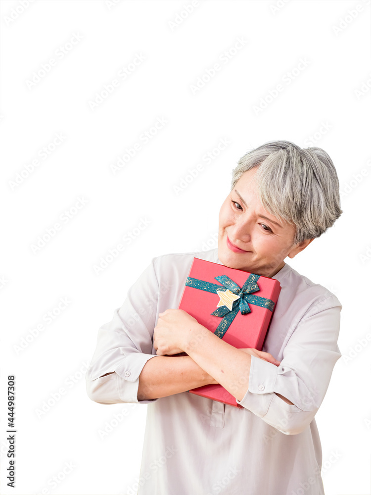 Senior asian woman holding gift over isolated background. Senior asian woman holding gift over isolated background.