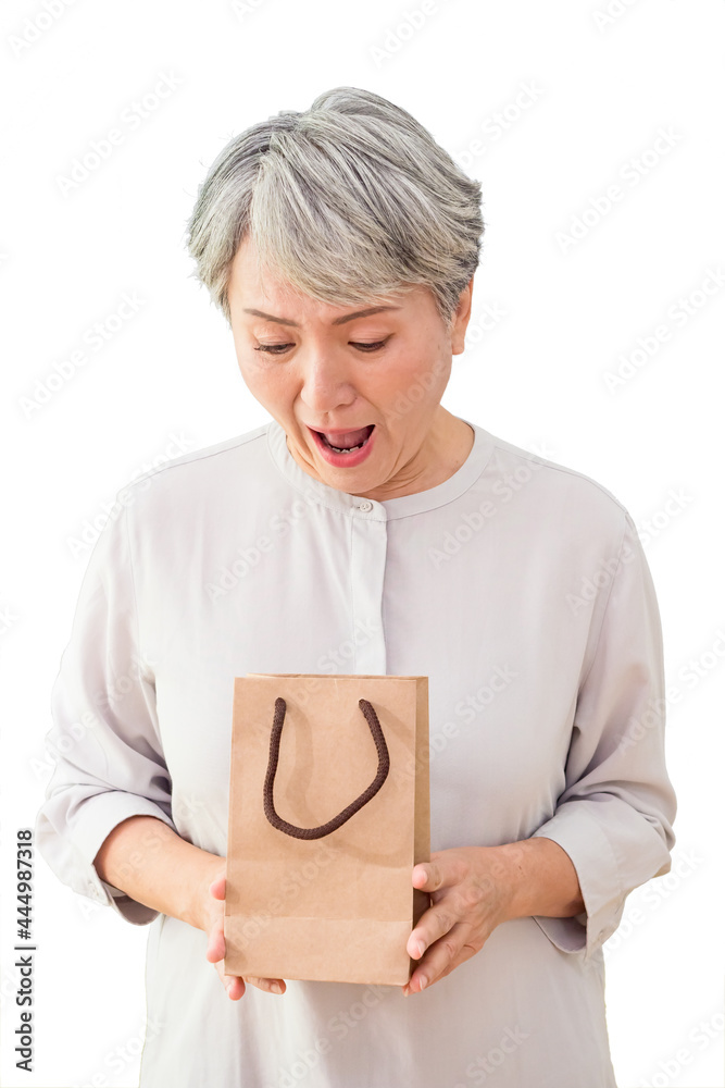 Senior asian woman holding gift over isolated background. Senior asian woman holding gift over isolated background.