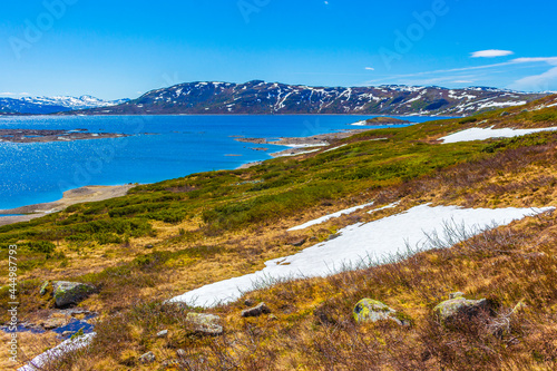 Amazing Vavatn lake panorama rough landscape boulders mountains Hemsedal Norway. photo