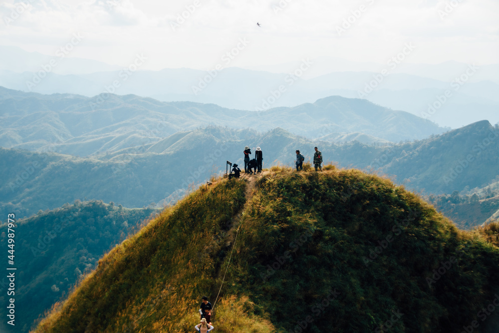 hiking group on mountain at Khao Chang Phuak, Thongphaphoom National Park, Kanchanaburi Province, Thailand. Subject is blurred, noise and color effect.