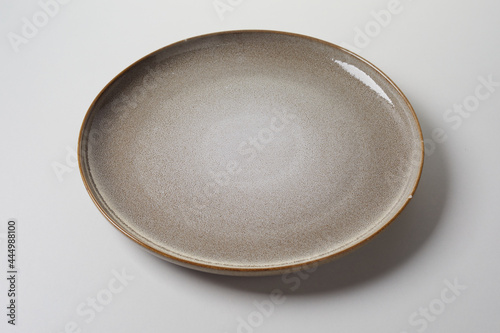 Rustic empty clean mottled brown round pottery plate