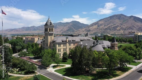 Aerial view looking over the Utah State University campus in Logan flying away from the historic Old Main Building. photo