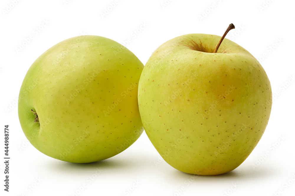 The fresh Golden Delicious apples are isolated on a white background. The fresh Golden Delicious apples are isolated on a white background.