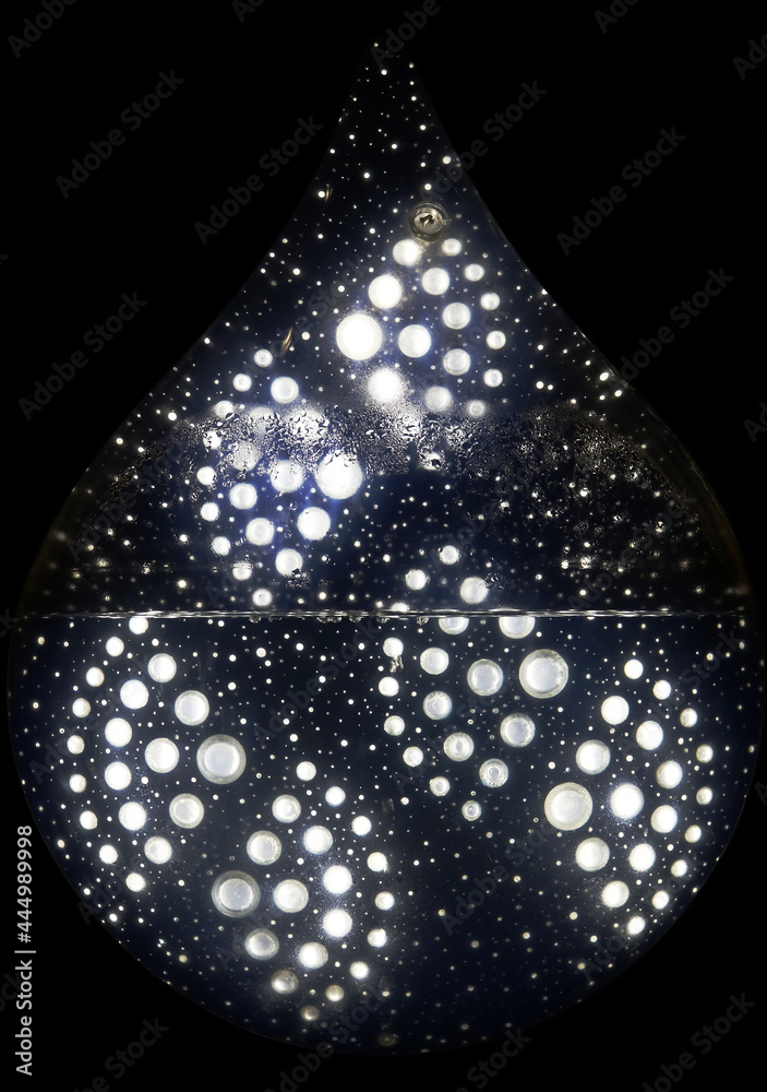 Obraz premium artistic work in the shape of a drop, with water and lights inside. MALBA